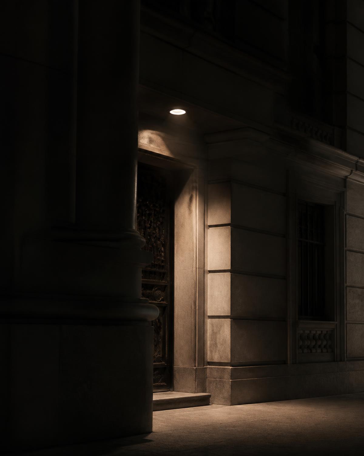 A lit New York building entrance at night